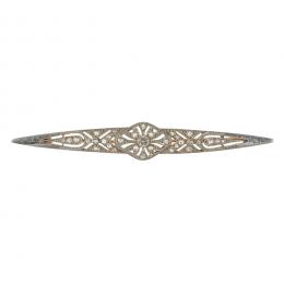 27   -  <p><span class="object_title">Broche estilo Art Déco en oro bicolor con diamantes tallas brillante antigua y rosa, 0,25 ct aprox. 8,5 cm. 8,60 gr. </span></p>