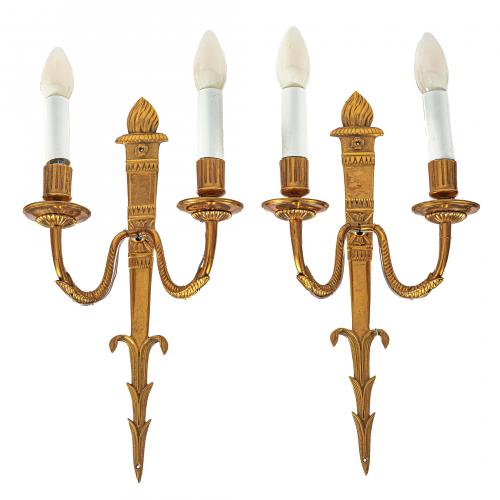 Pareja de apliques de pared estilo Imperio en metal dorado 