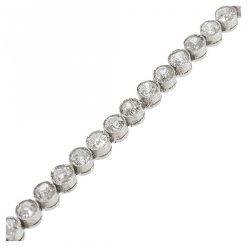 Pulsera rivière en oro blanco con chatones de diamantes tal