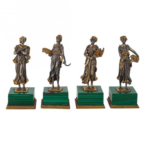 Juego de cuatro figuras femeninas representando las cuatro 
